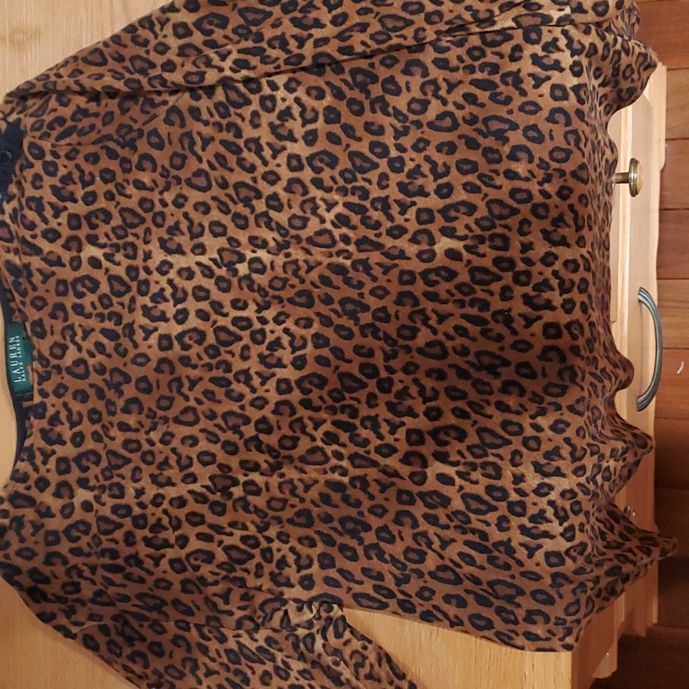 Leopard print shirt.snaps on left shoulder,  soft material. Worn once and shrunk